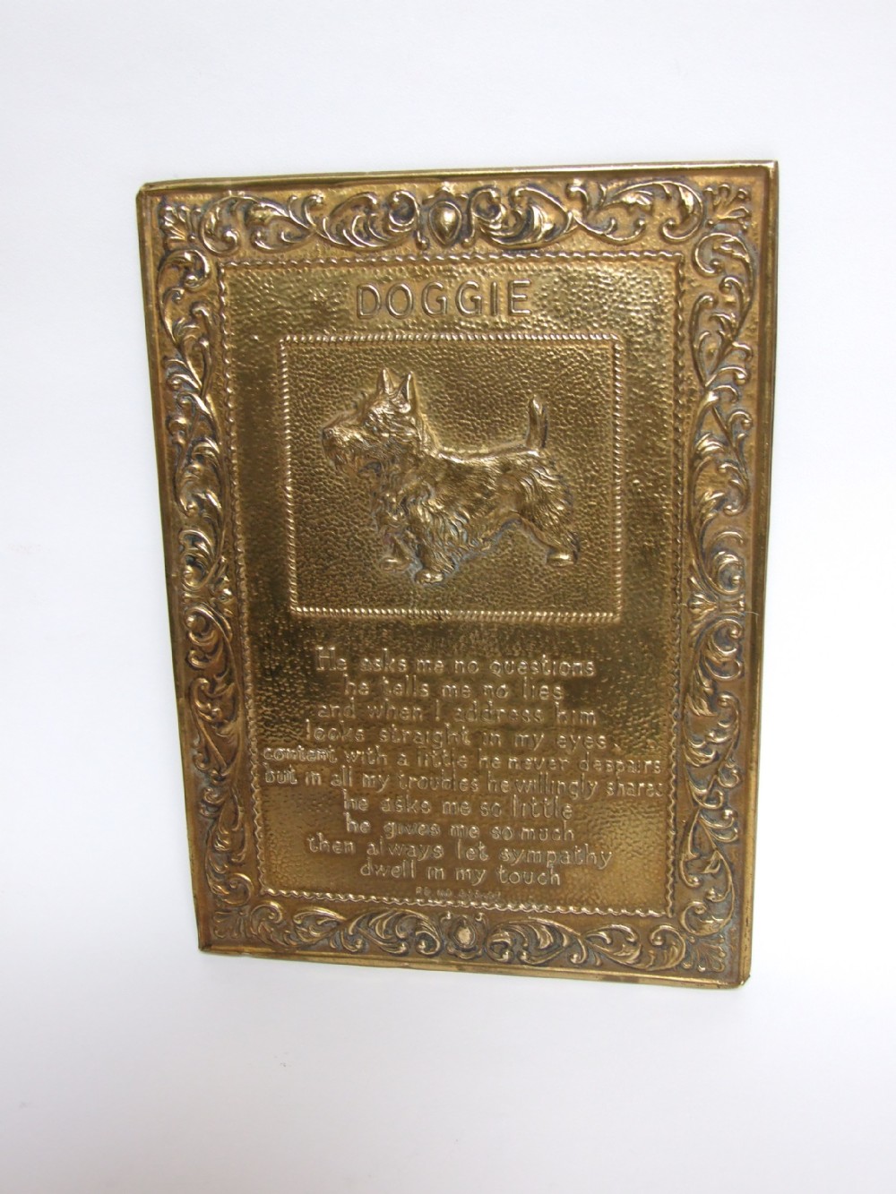 A delightful vintage Brass 'Doggie' wall plaque.