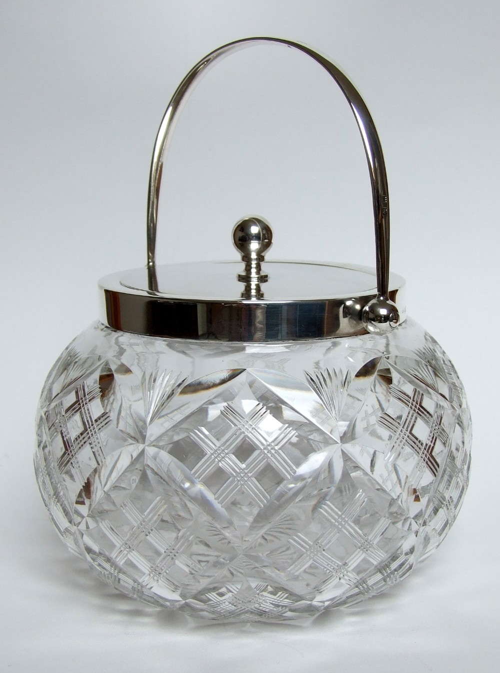 A fabulous George V silver mounted biscuit barrel.
