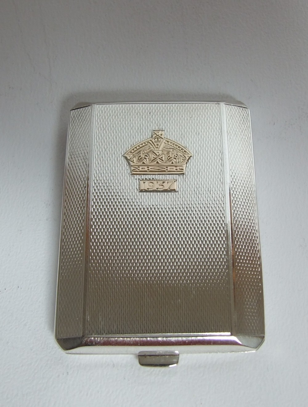 A rare, collectable silver & gold George VI match book holder.