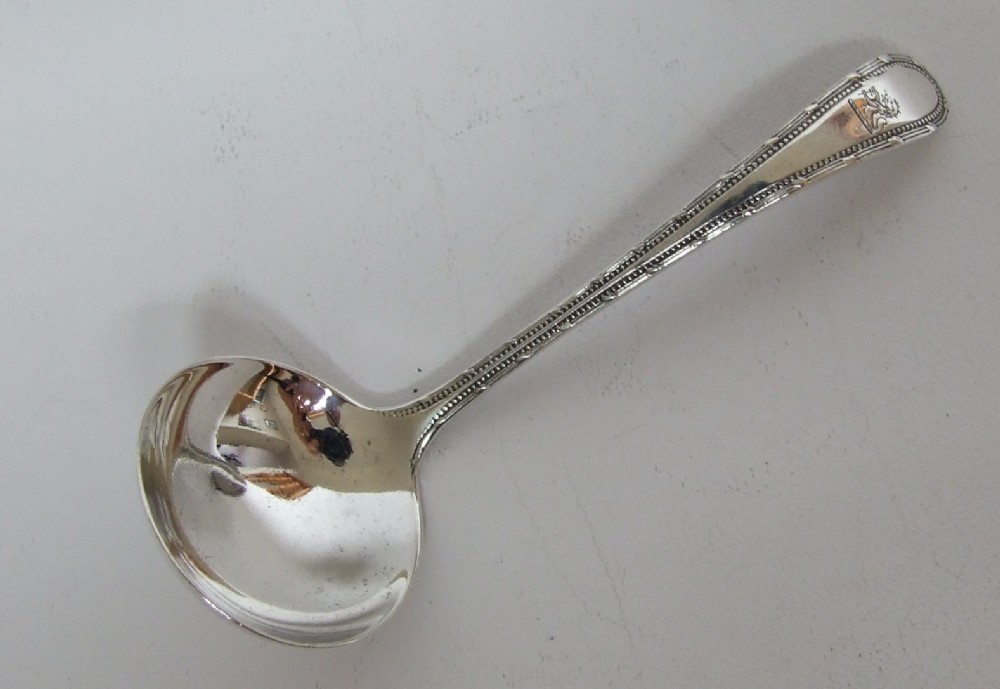 A First World War silver cream ladle.
