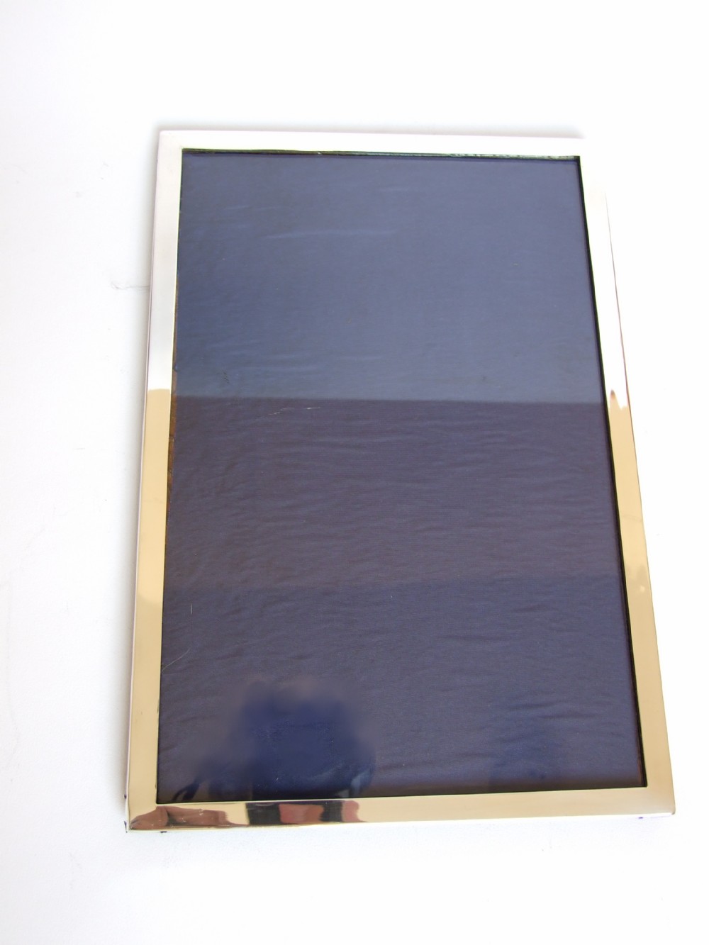 A large silver portrait/landscape photo frame.