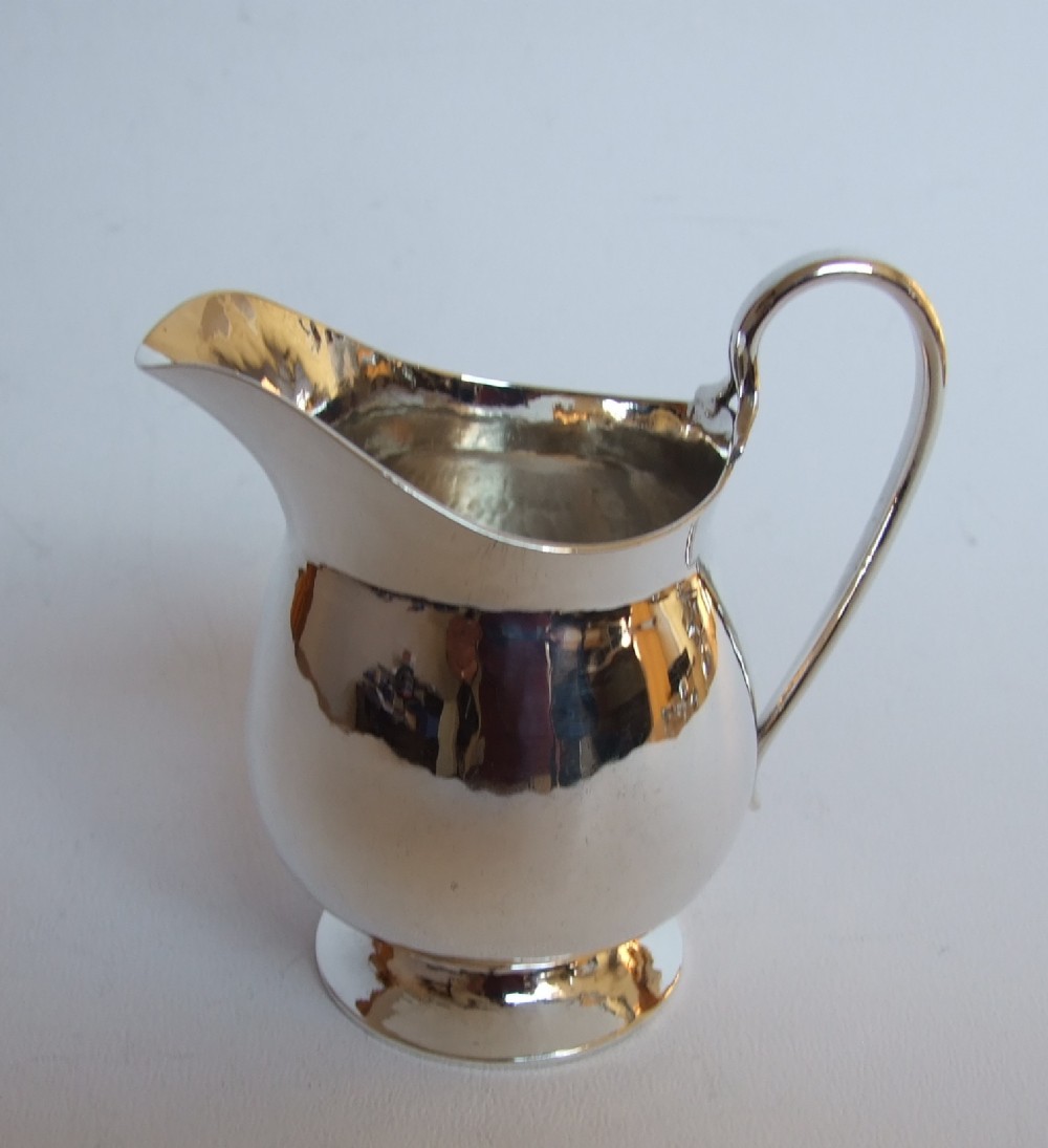 A superb quality Arts & Crafts silver cream jug.