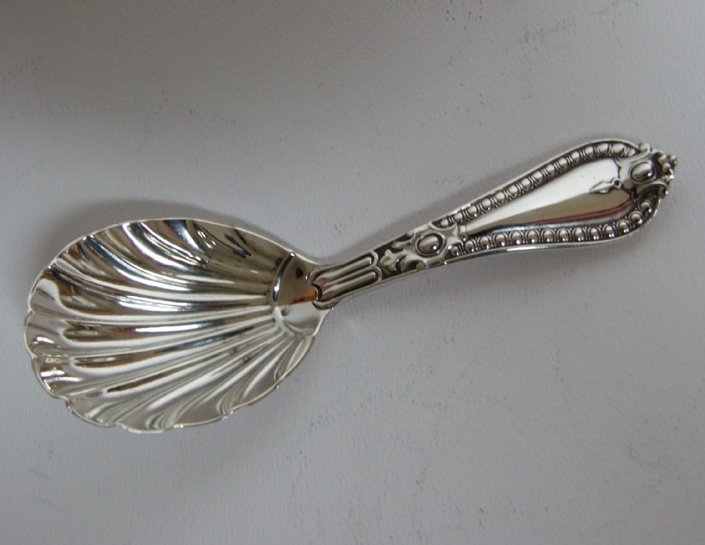 A rare Victorian silver Grecian pattern caddy spoon.