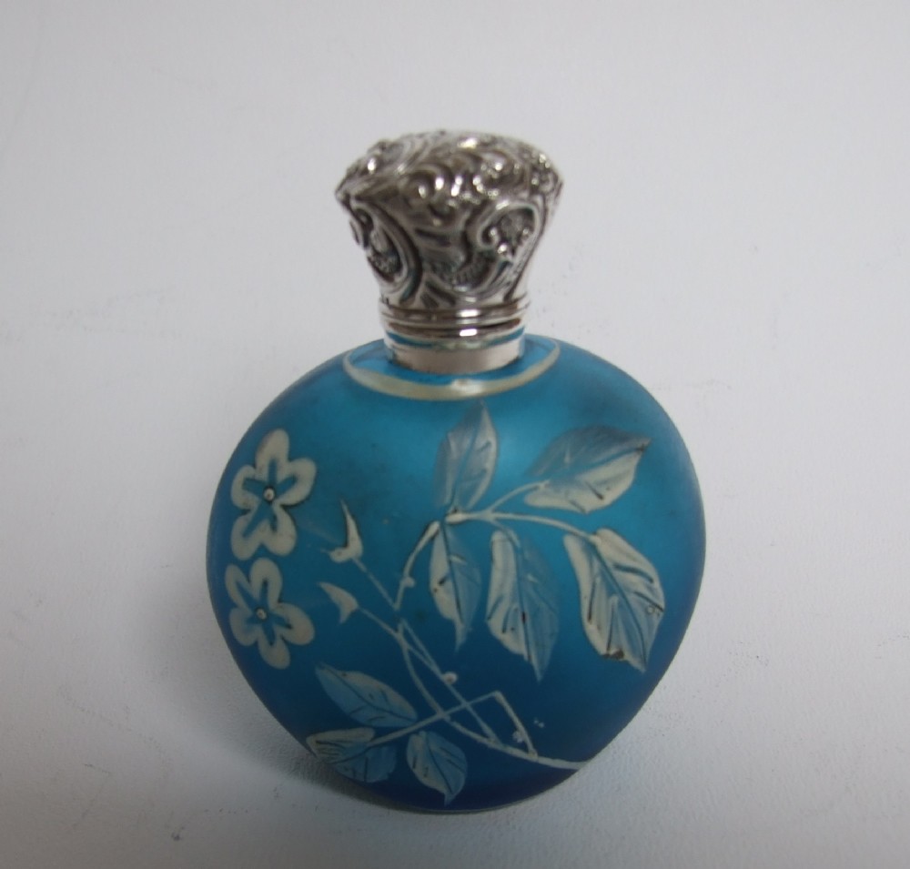 A gorgeous Victorian silver mounted and enamel painted scent bottle.