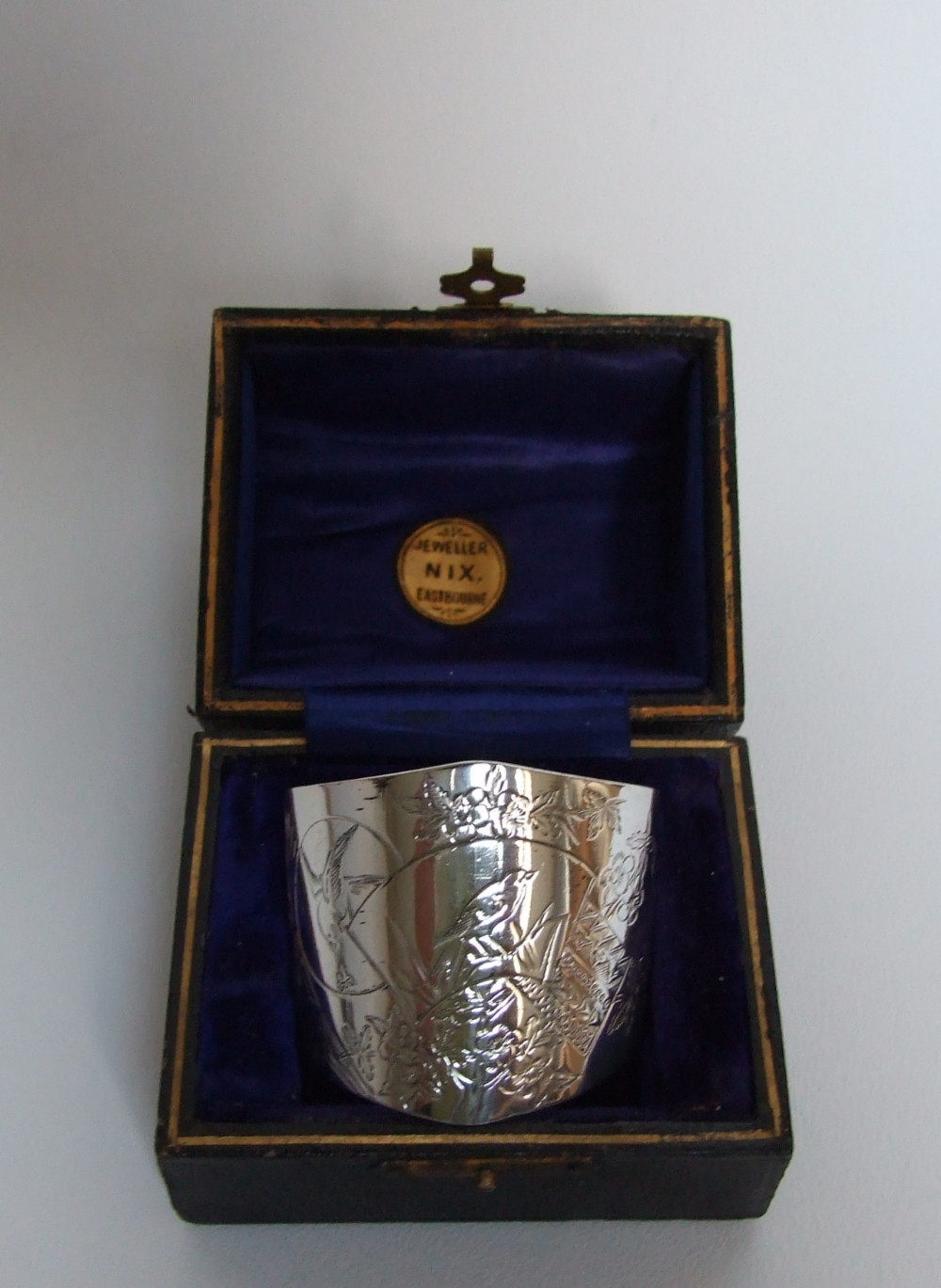 A wonderful boxed Victorian silver aesthetic movement napkin ring.