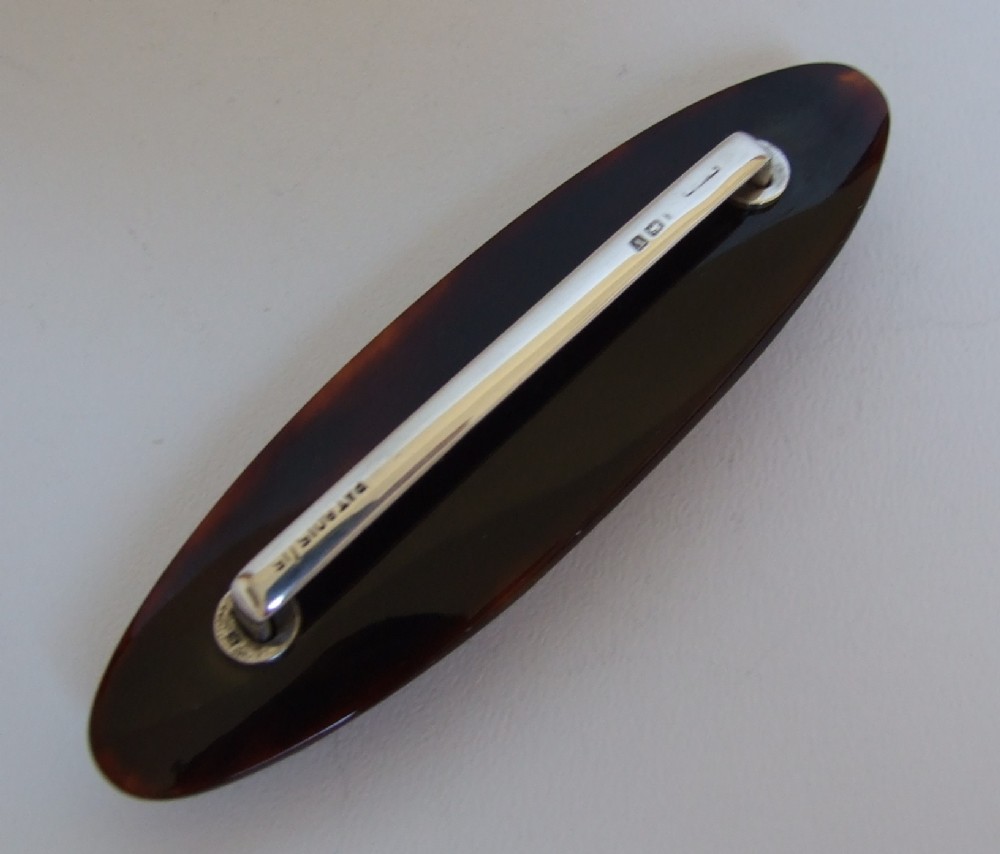 A lovely silver & tortoiseshell nail buffer.