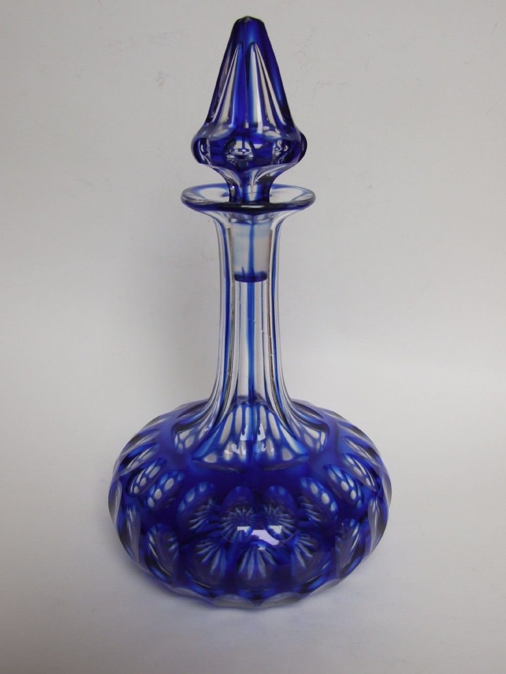 A rare Victorian cut-through blue decanter.