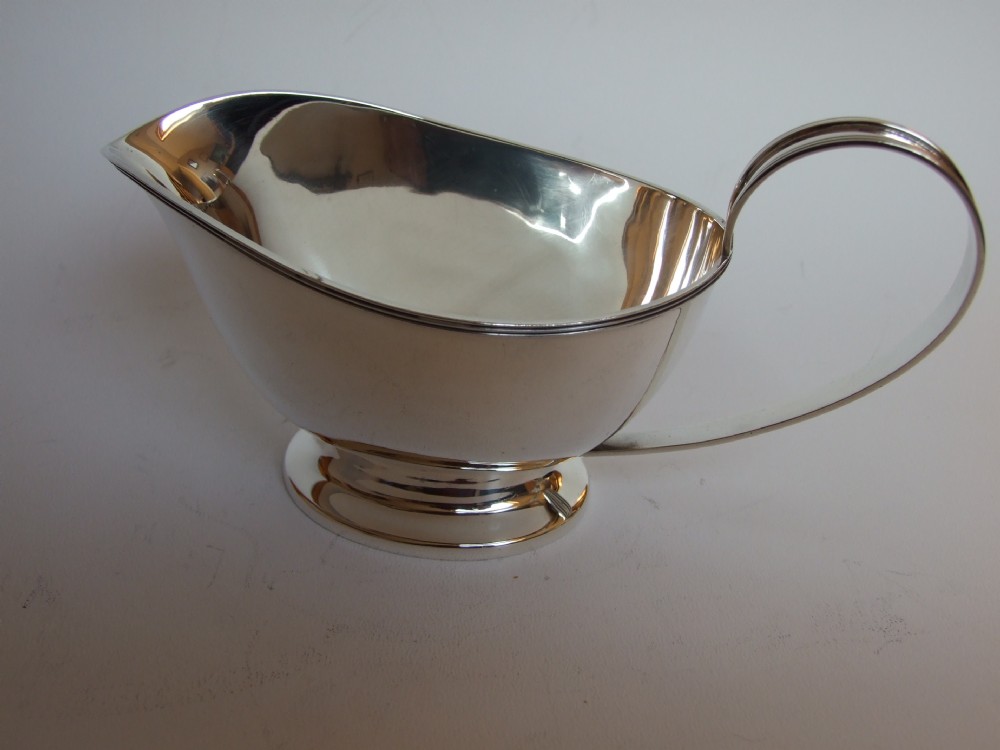 A handsome Art Deco period silver gravy boat.