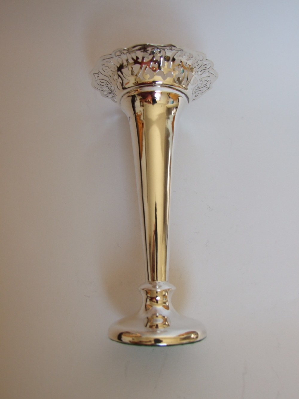 A gorgeous Edwardian silver vase with pierced rim.