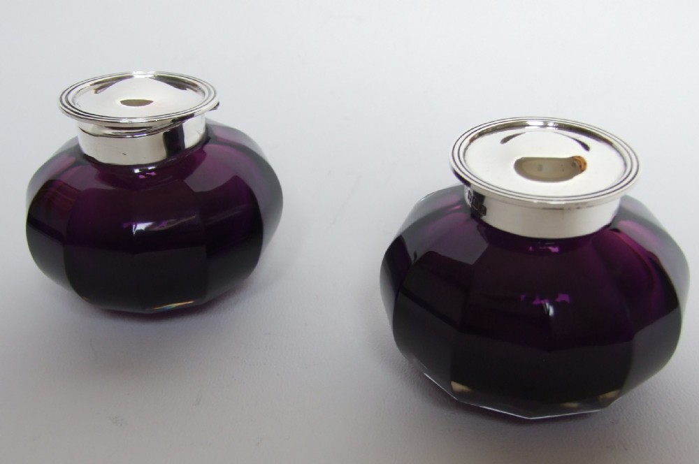 A stunning pair of silver & amethyst glass inkwells.