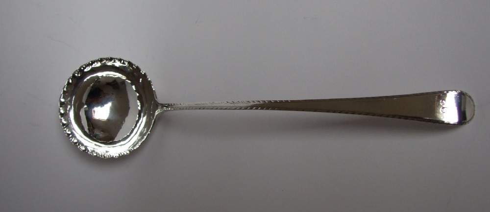 A magnificent George II silver soup ladle.
