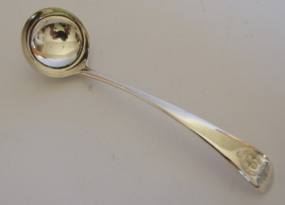 A lovely 18th Century silver cream ladle.