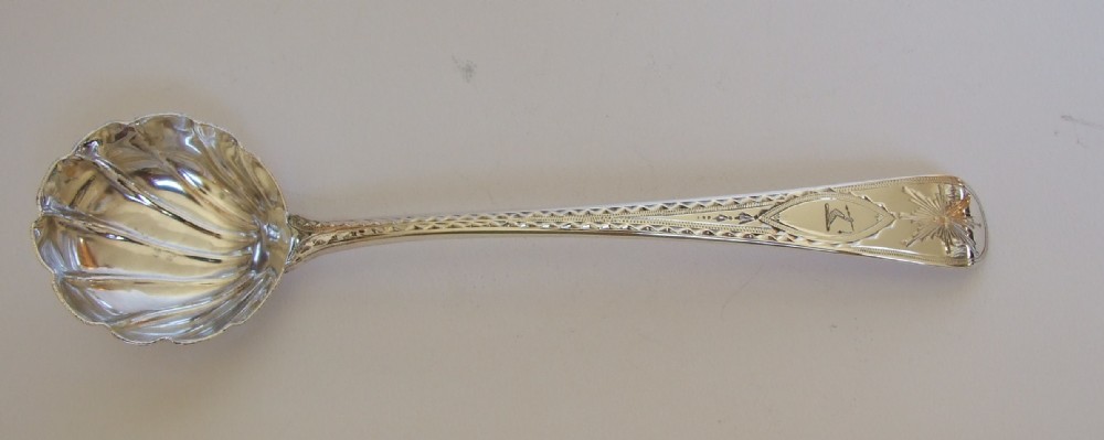 A fabulous 18th Century Bright Cut silver gravy/sauce ladle.