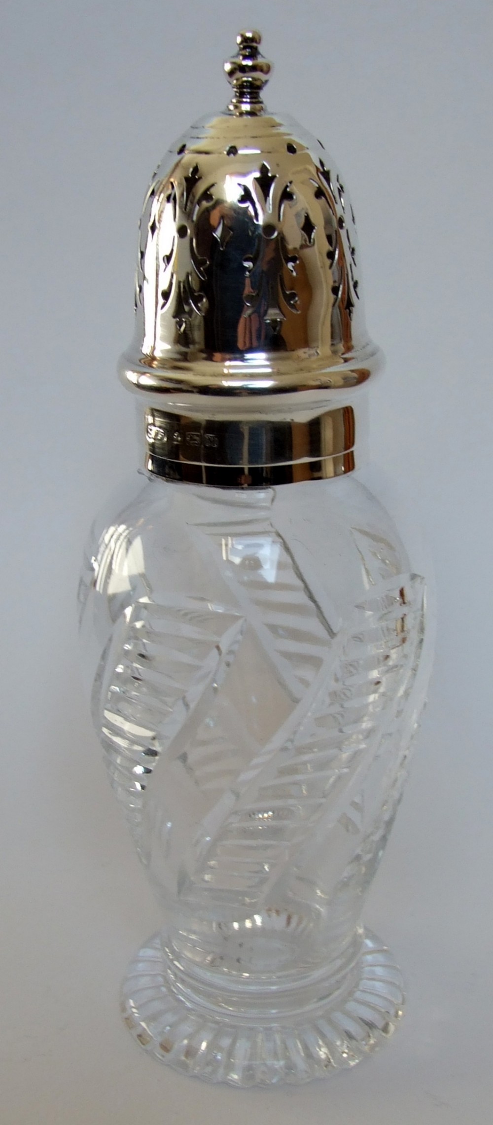 A handsome silver mounted sugar caster.