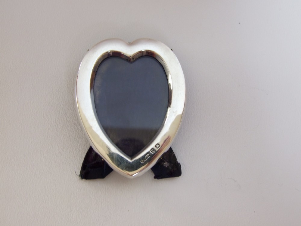 A lovely Victorian heart shaped small silver photo frame.
