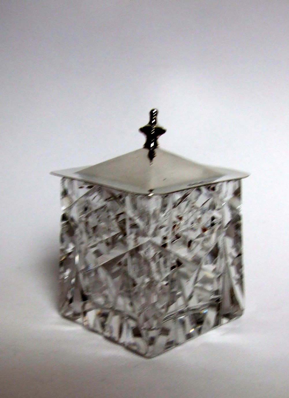 An unusual silver lidded 'pagoda' style preserve jar.