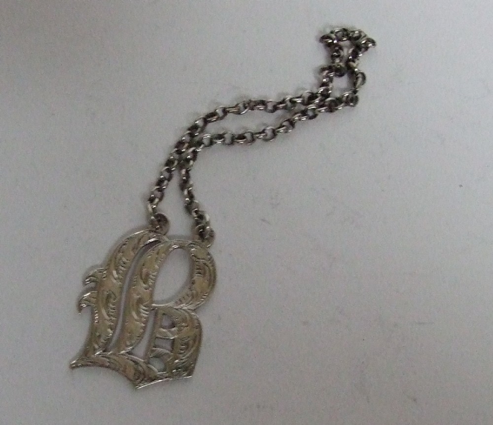 A superb early Victorian silver Brandy label.