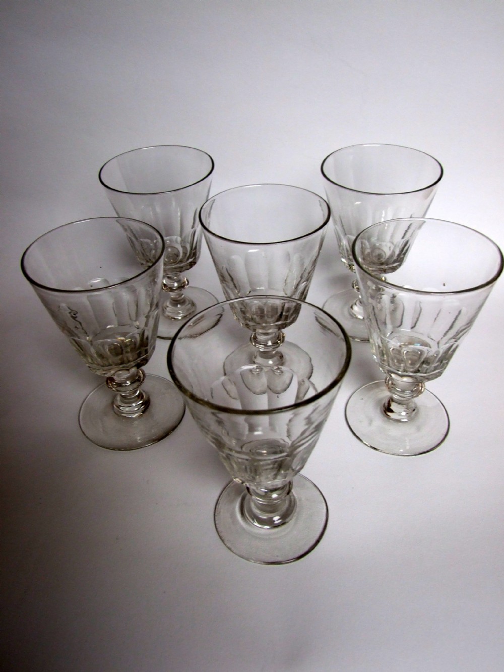 A fabulous set of six cut glass wine goblets.