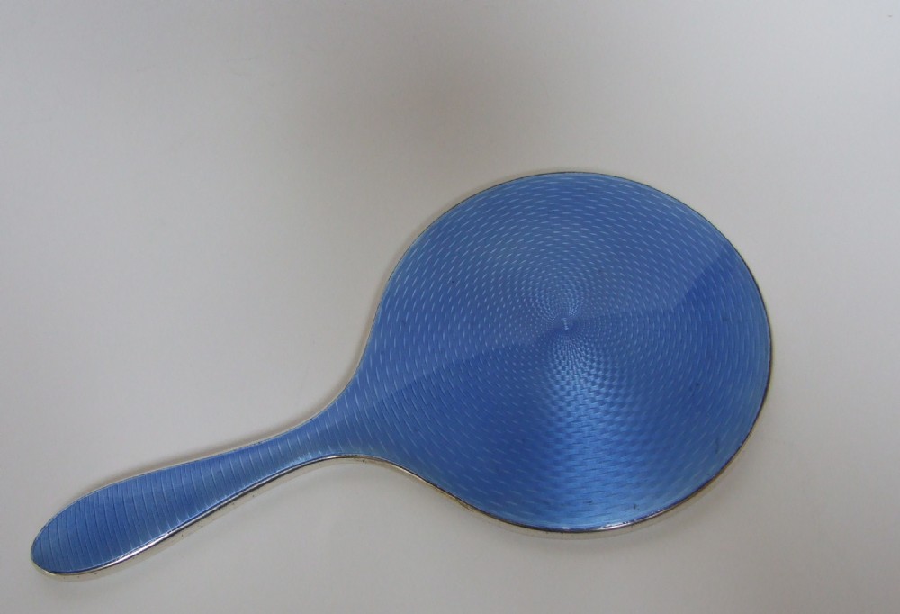 A gorgeous silver & guilloche enamel hand mirror.