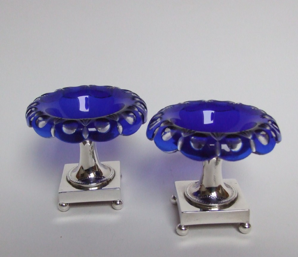 A stunning pair of cut glass and silver plated condiment stands.