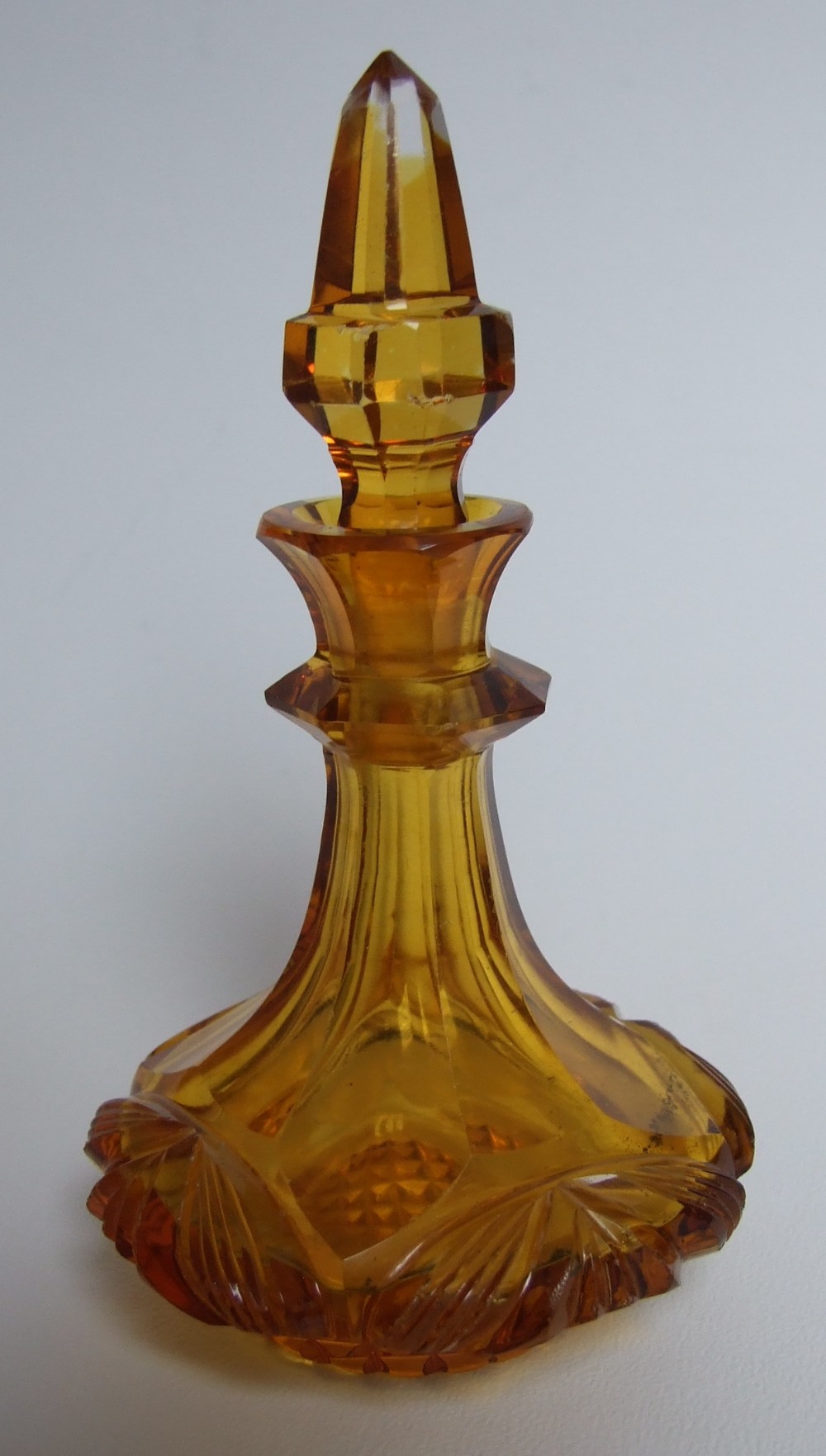 A Victorian gothic amber glass scent bottle.