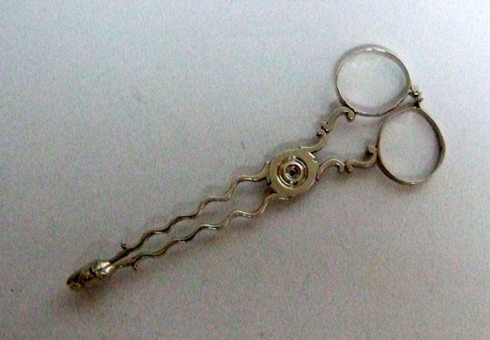 An unusual pair of 18th Century silver tea tongs.