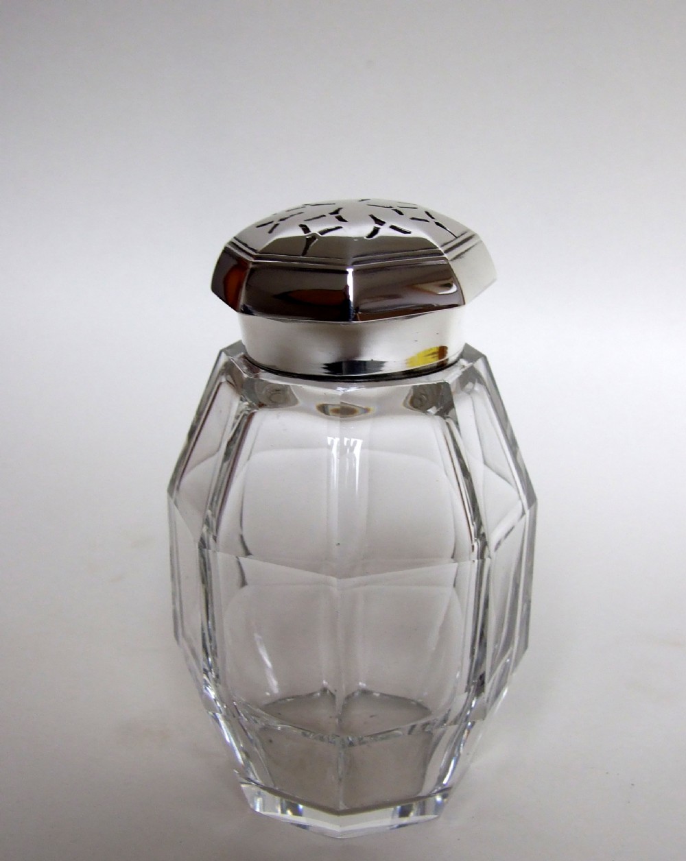 An Art Deco silver mounted sugar caster.