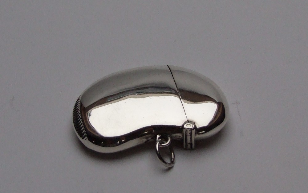 A rare silver kidney bean vesta, exactly 100 years old.