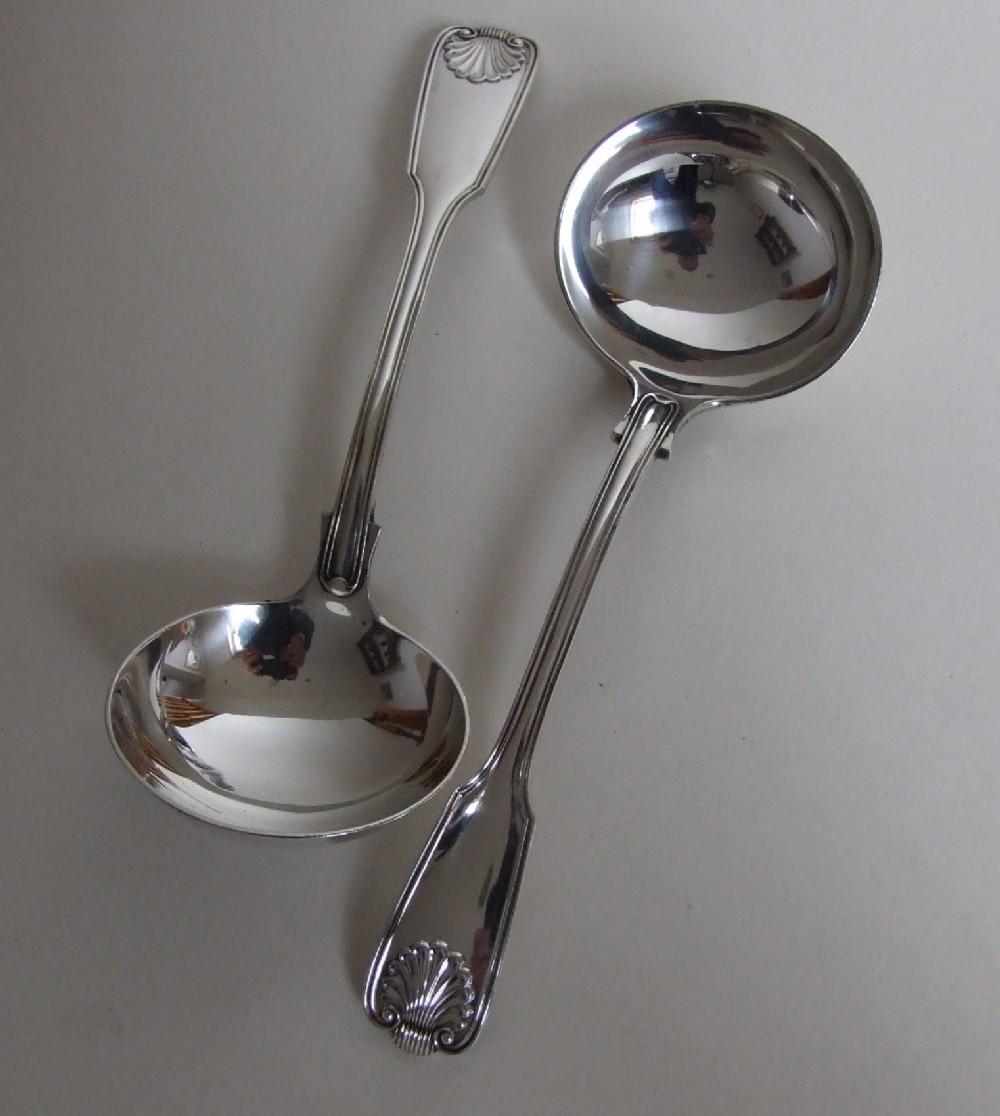 A superb pair of silver gravy/sauce ladles in fiddle, thread & shell pattern.
