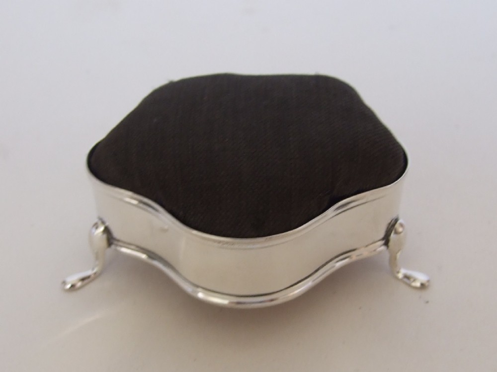 An unusual Edwardian novelty Chester silver pincushion.