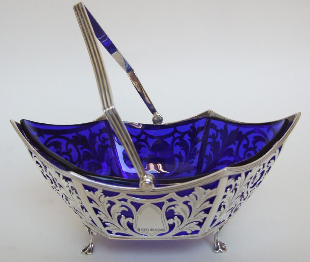 A splendid Edwardian silver sweetmeat basket.