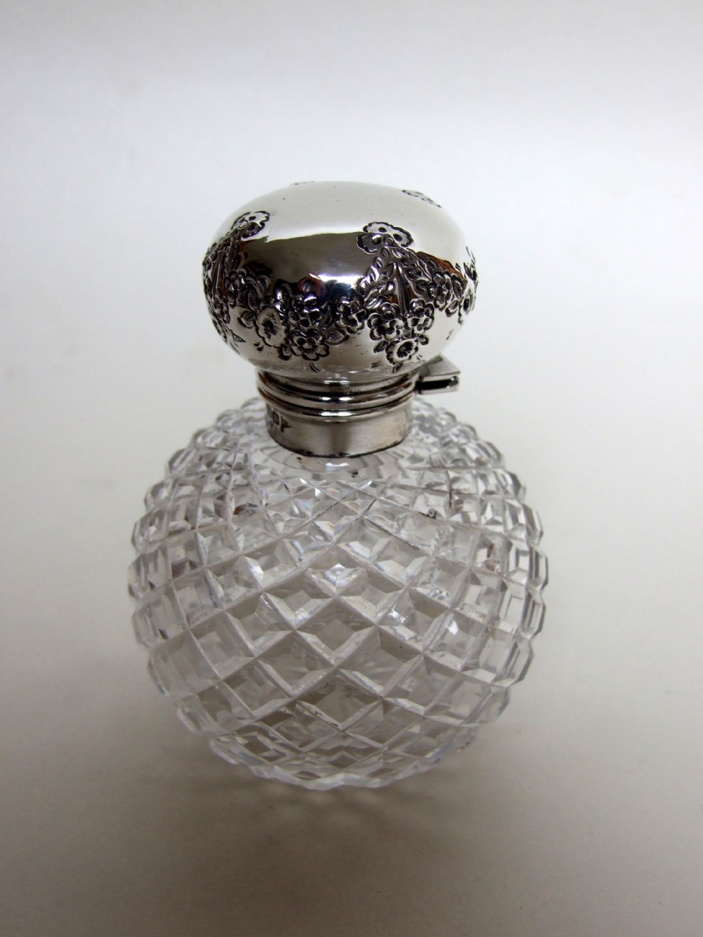 A gorgeous First World War silver mounted cologne bottle.