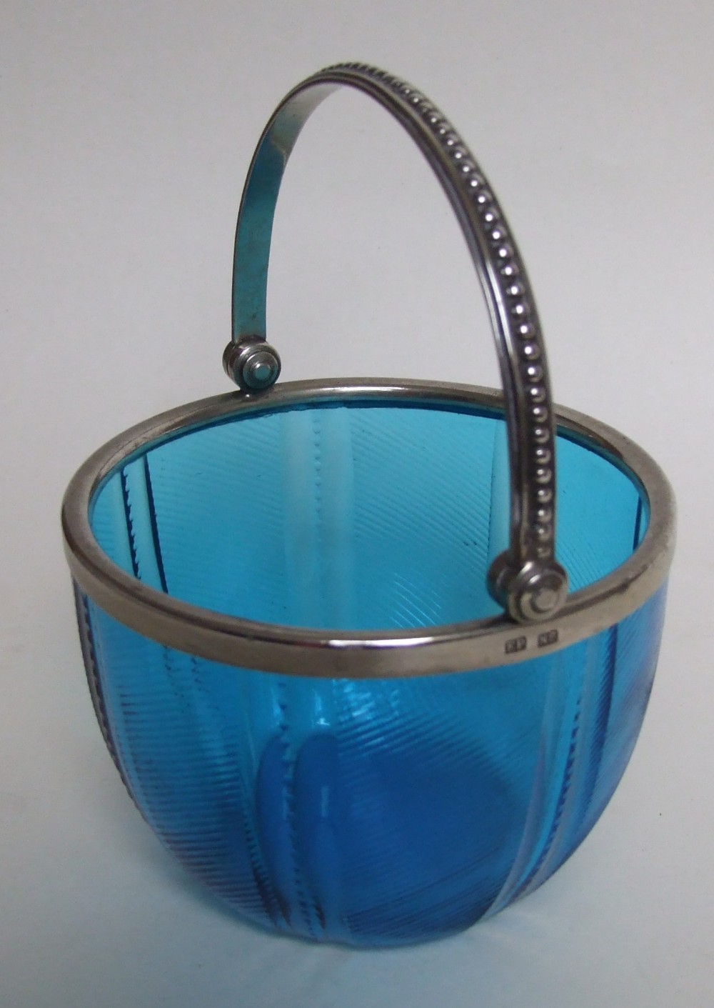 A charming silver plated and glass sweetmeat basket.