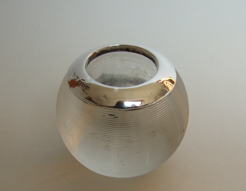 An Edwardian silver mounted match striker.