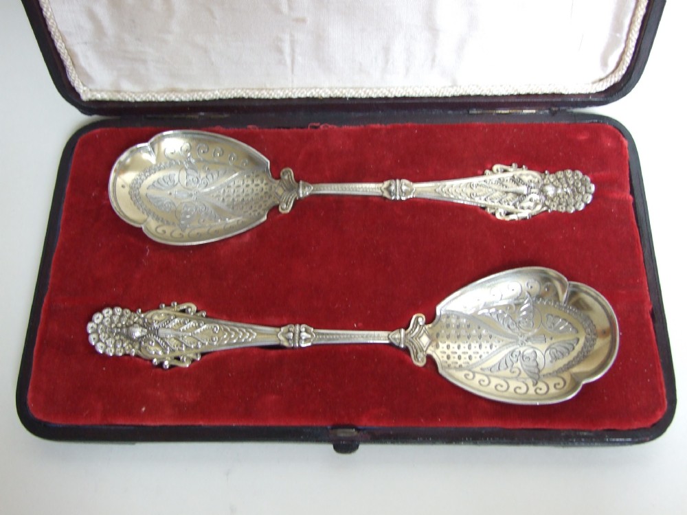 A fabulous pair of boxed Victorian silver gilt dessert servers.