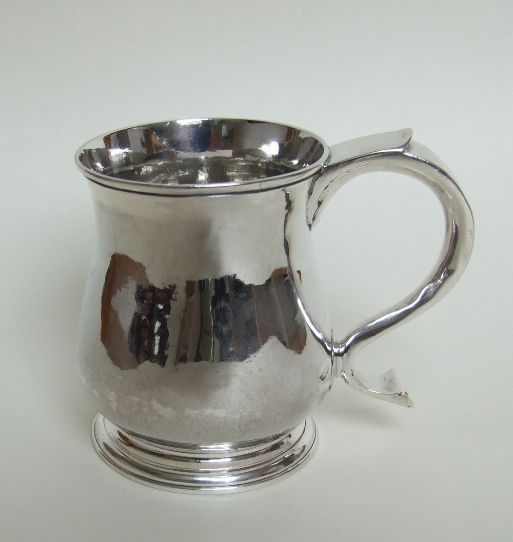 A rare George II silver half pint tankard.