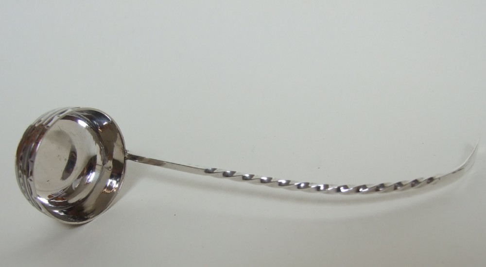 A gorgeous Victorian silver toddy or cream ladle.