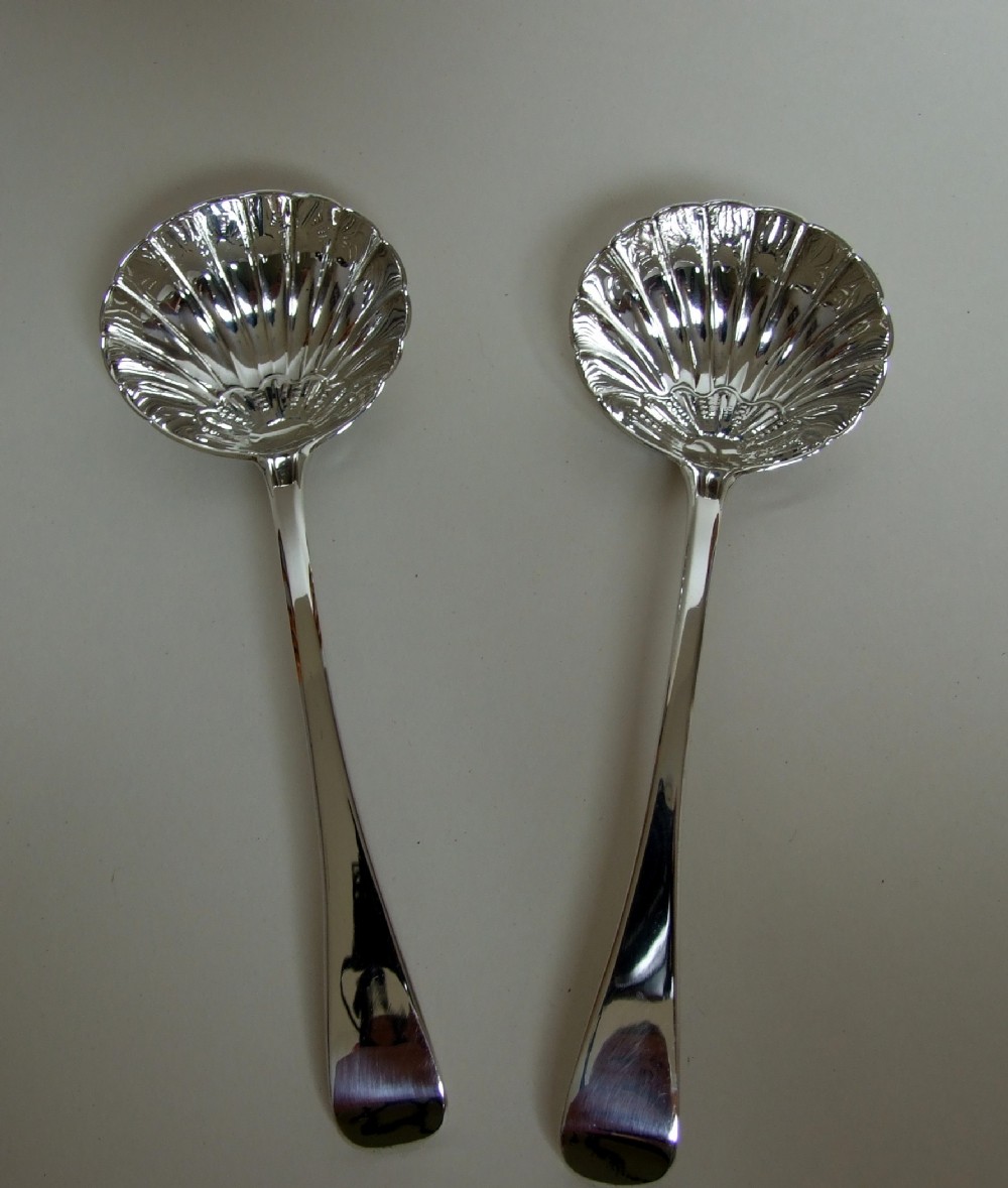 A superb pair of William IV silver gravy ladles.