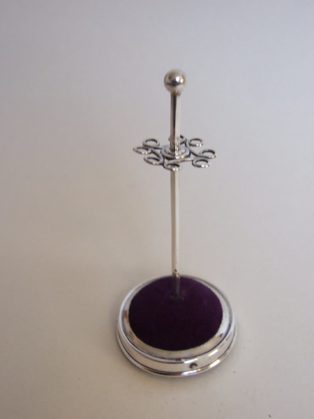 A handsome Edwardian silver hatpin stand.