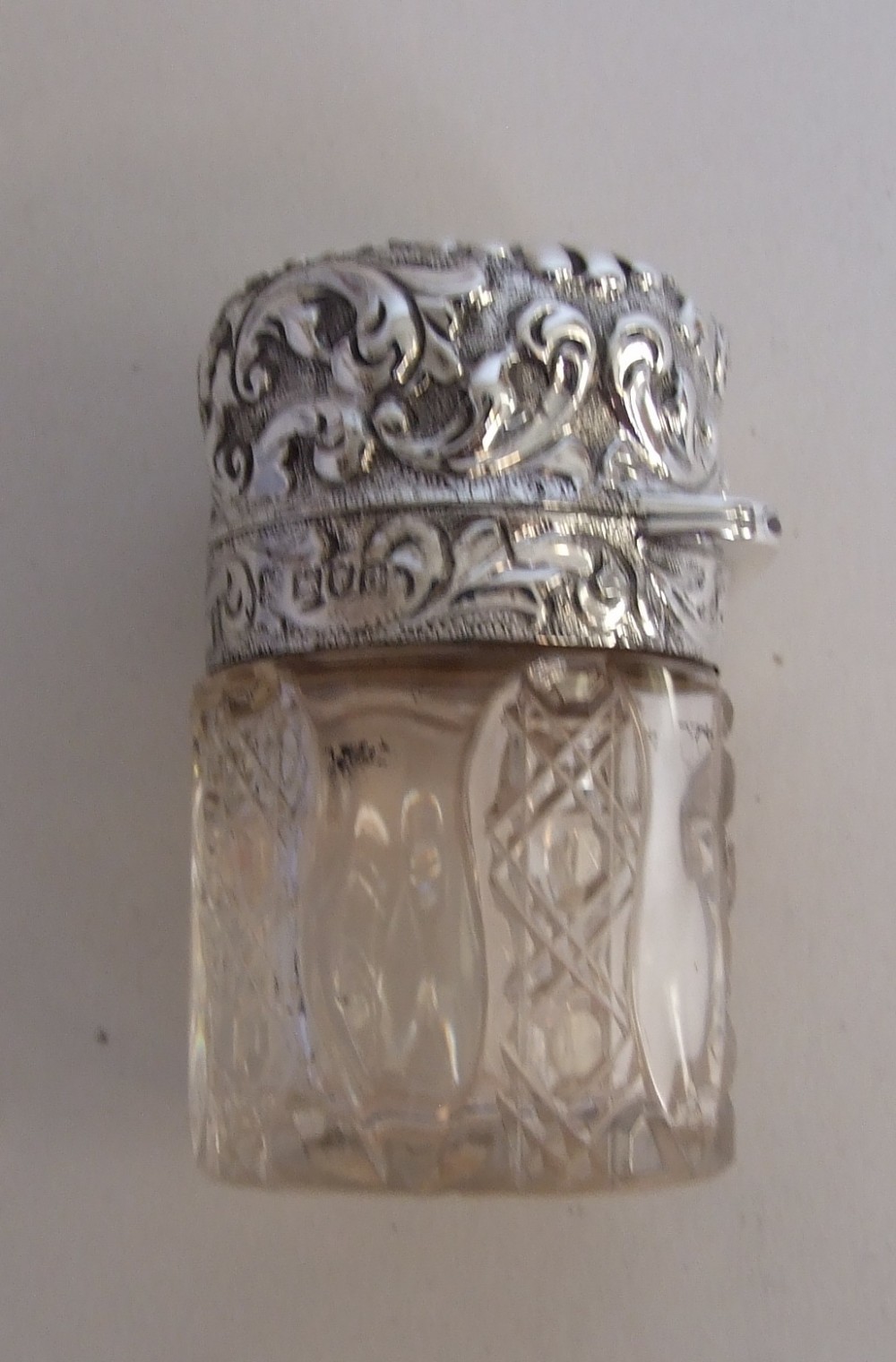 A splendid Victorian silver mounted salts/cologne bottle.