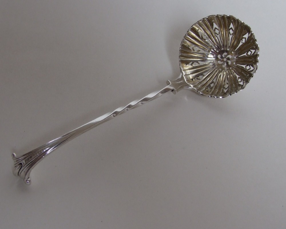A superb Victorian silver Onslow pattern sifter spoon.