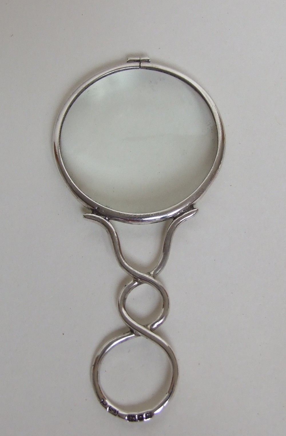 An Asprey retailed Edwardian magnifying glass.