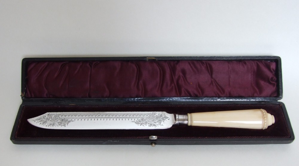 A fabulous silver mounted and boxed Victorian Wedding Cake knife. 