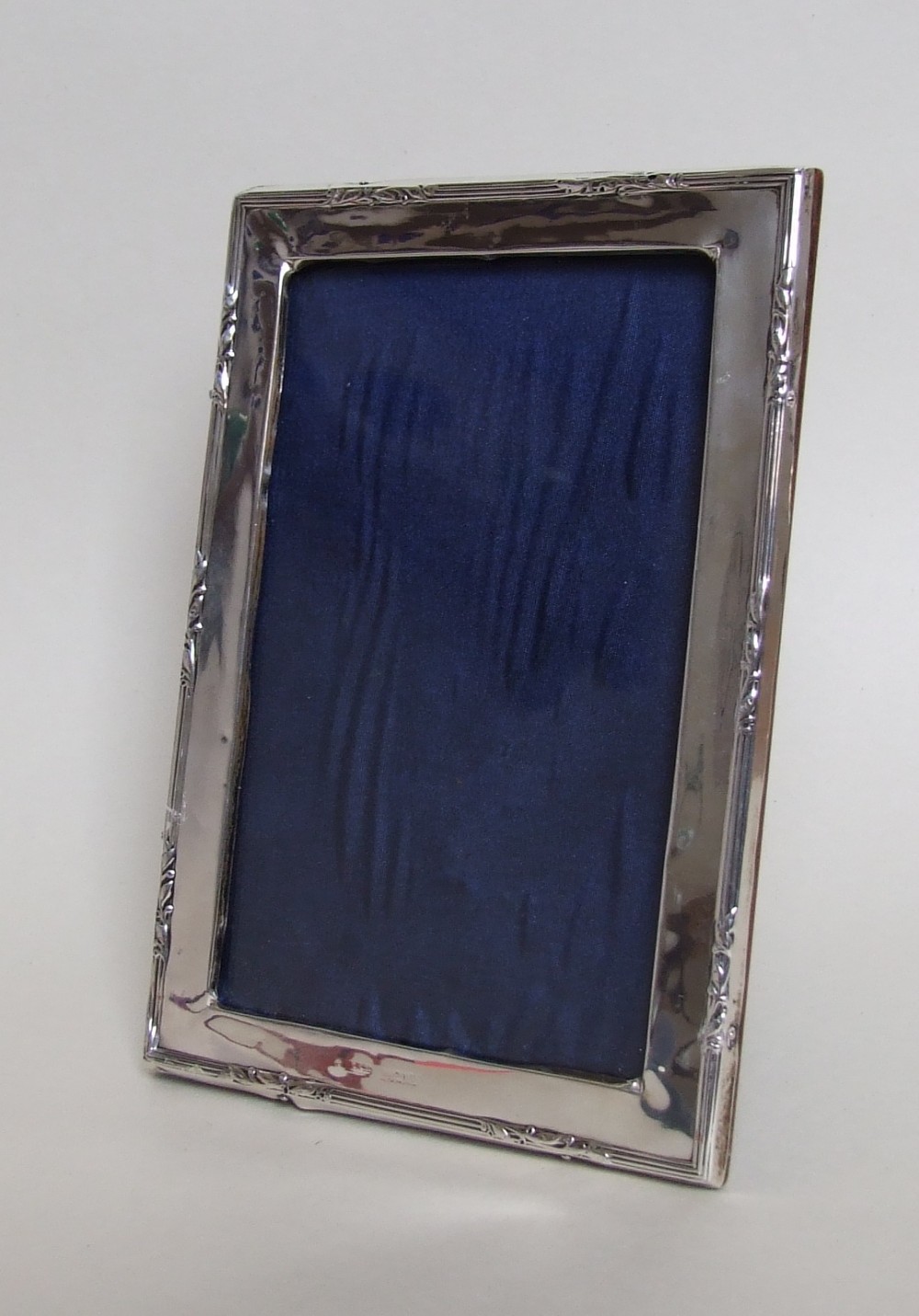 A useful and attractive silver photo frame of portrait/landscape form.