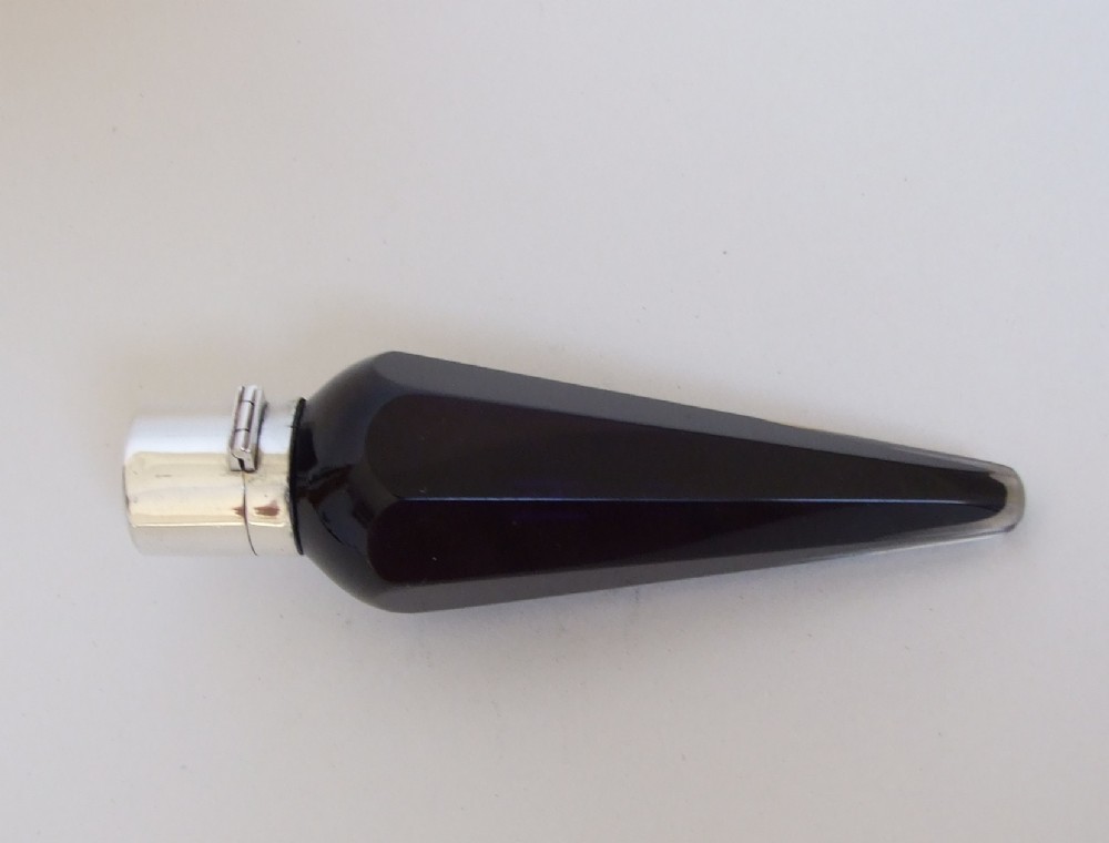 A wonderful novelty silver and amethyst glass 'umbrella' scent bottle.