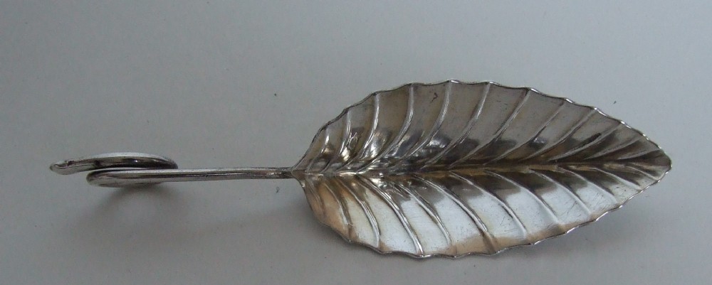 An unusual silver plated leaf caddy spoon.