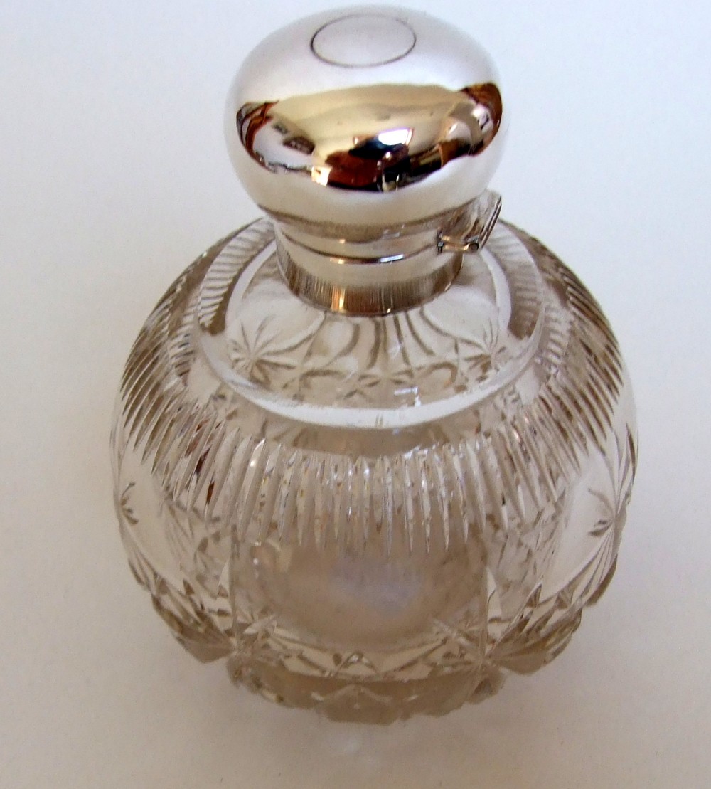 A splendid silver mounted cologne bottle.
