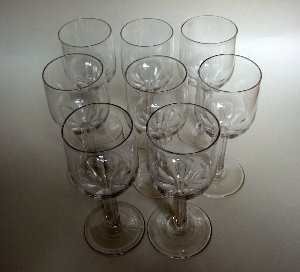 A rare set of eight Victorian hollow stem wine glasses.