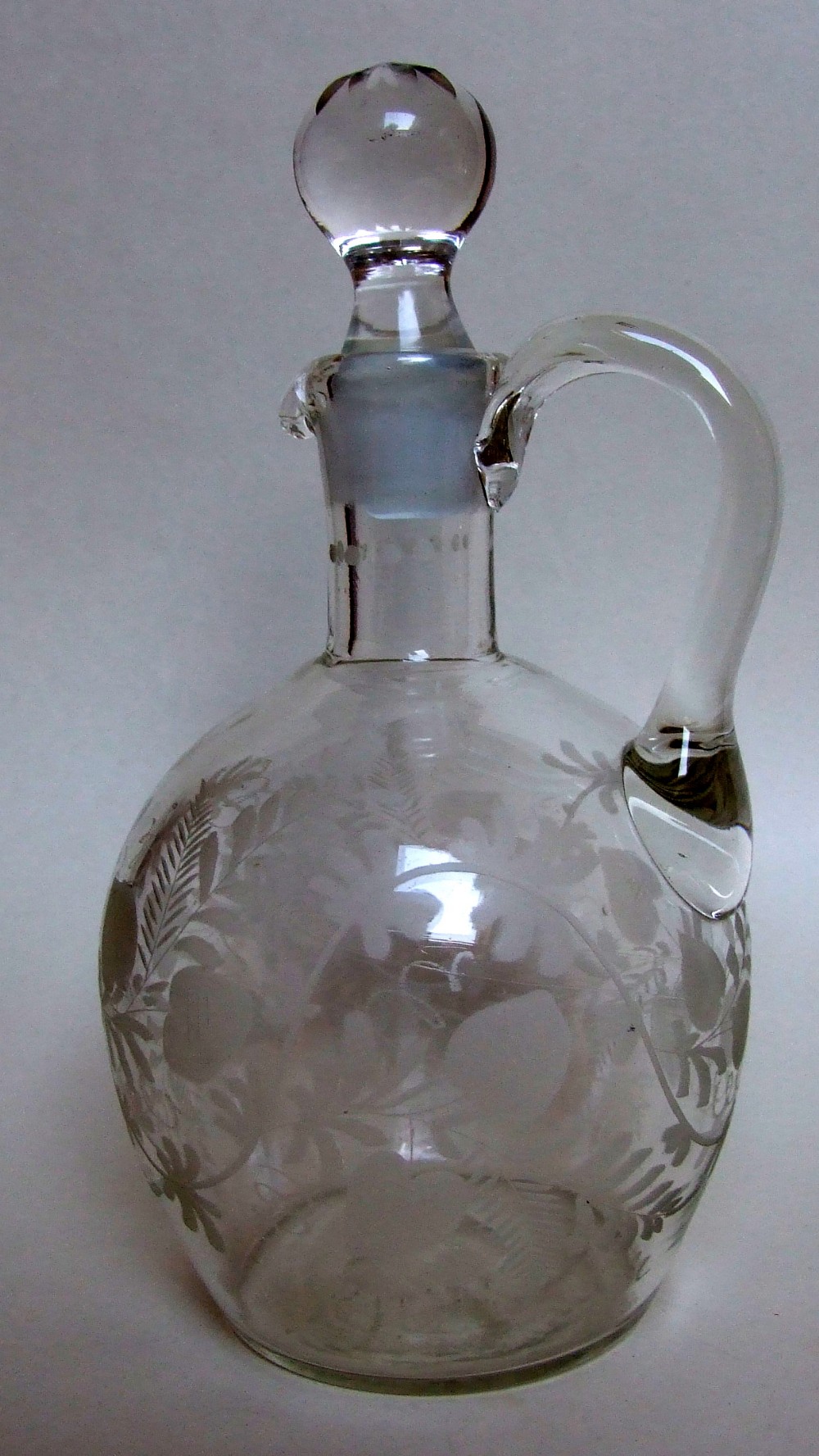 A Victorian etched wine jug and stopper.