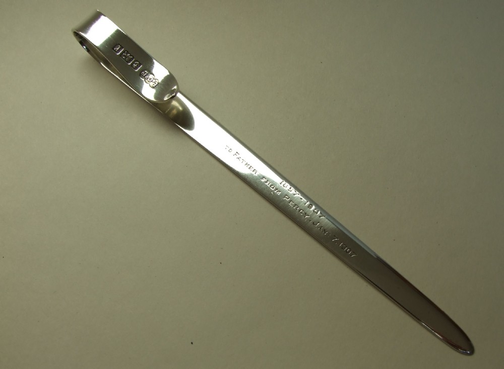An extremely rare Edwardian silver letter opener/ruler combination.